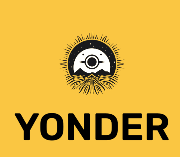 Yonder emblem — a sun rising over mountains